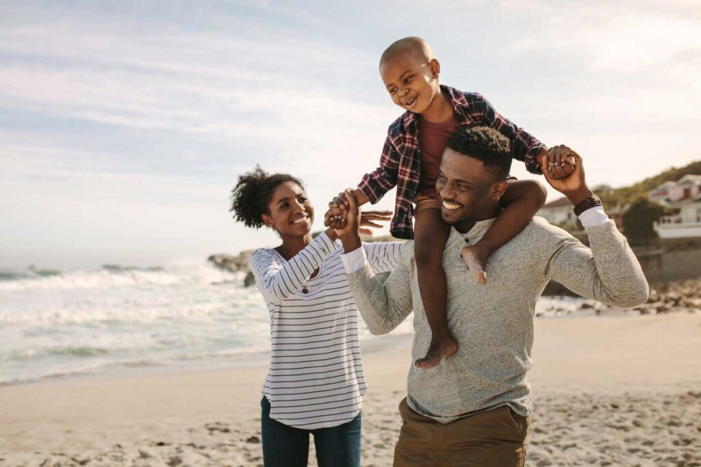 Community Page Slider Image of a family on the beach