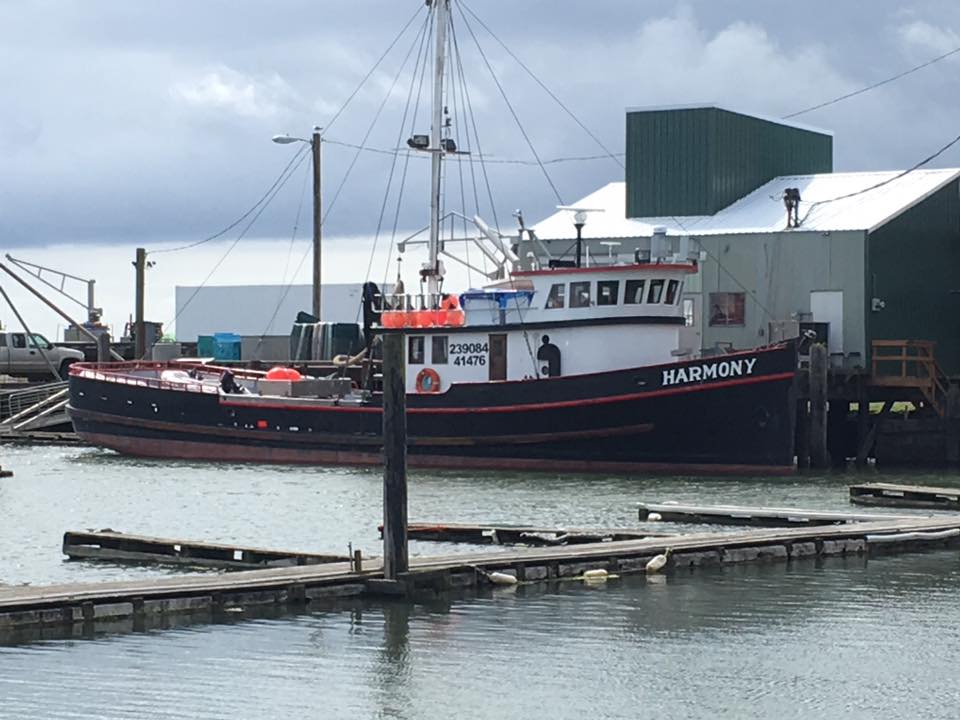 An Image of 'Harmony', one of the many ships that calls the Chinook Harbor home, as it's being prepared to set out to sea.