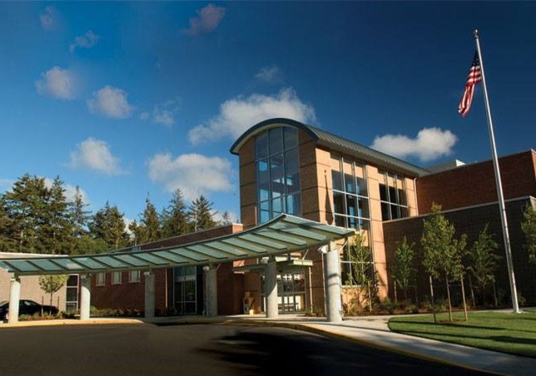An image of the exterior of the Ocean Beach Hospital on a sunny, summer day.