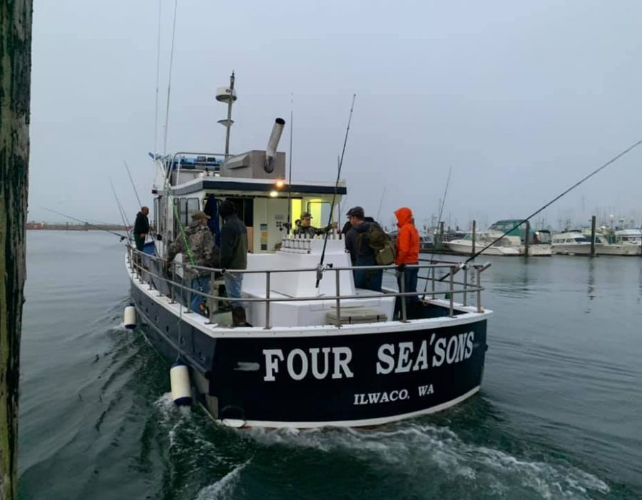 An image of a local fishing ship called the Four Seasons as it leaves the harbor.