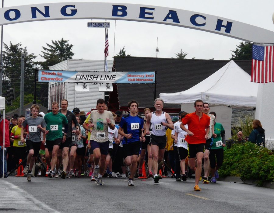 An image of runners starting their journey on the Long Beach marathon in late spring.