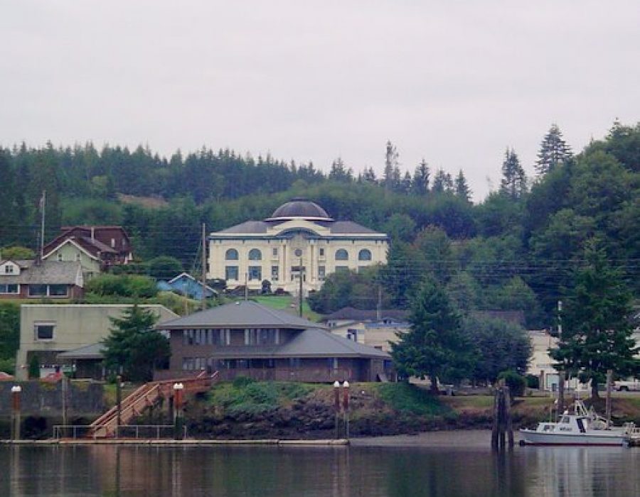An image of an old colonial style mansion set high upon a hill overlooking the South Bend river.