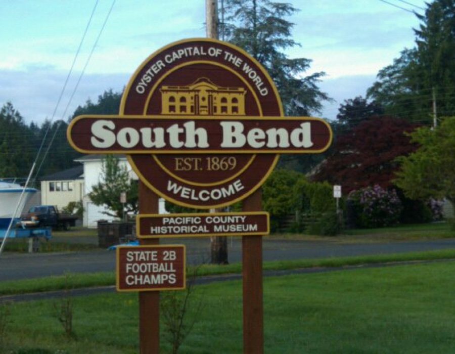 An image of the official South Bend Signpost which proudly proclaims South Bend to be the Oyster Capital of the World.