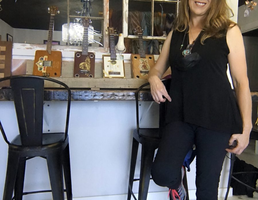 An image of a woman posing by the bar at Bold Coffee, a local coffee shop.
