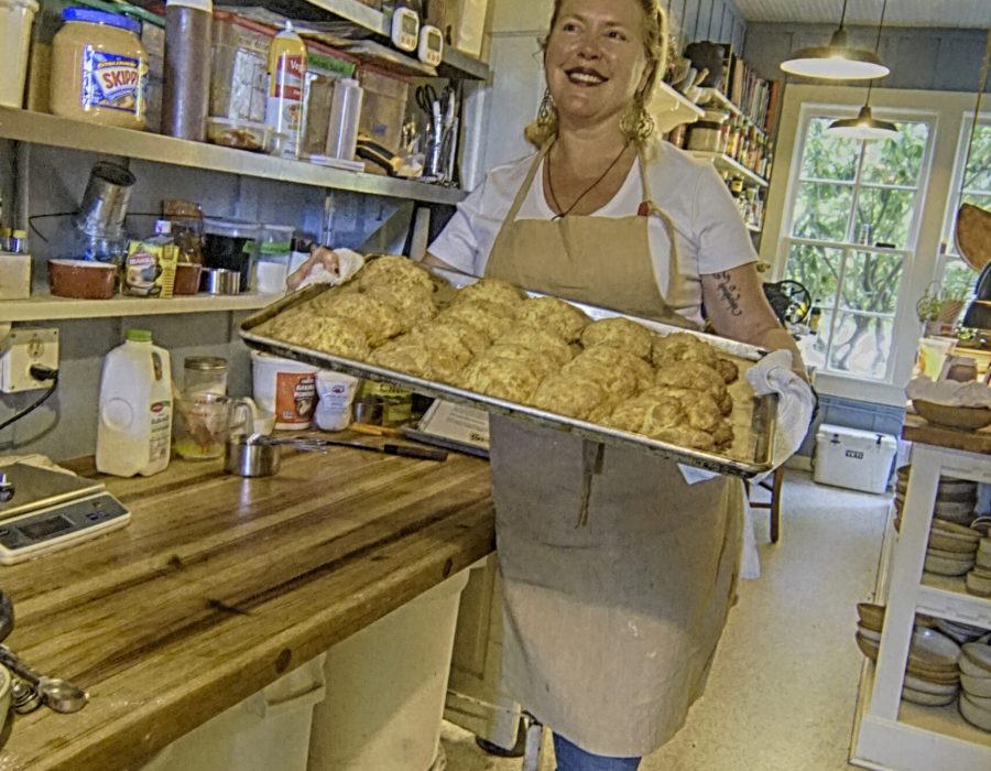 An image of heather, presenting her freshly baked biscuits in the Tokeland Hotel.